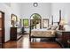Serene bedroom with hardwood floors, lots of natural light, and a spacious layout at 5904 Meadowbrook Dr, Morrison, CO 80465