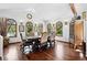 Bright dining room with hardwood floors, and lots of natural light at 5904 Meadowbrook Dr, Morrison, CO 80465