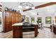 Spacious eat-in kitchen with stainless appliances, an island cooktop, and tile floors at 5904 Meadowbrook Dr, Morrison, CO 80465