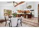 Eat-in kitchen with stainless appliances, granite counters, tile floors, and a large window at 5904 Meadowbrook Dr, Morrison, CO 80465