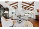 Living room with high beamed ceilings, a fireplace, and hardwood floors at 5904 Meadowbrook Dr, Morrison, CO 80465