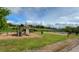 View of the community playground with slide, sandbox, and picnic shelter at 5904 Meadowbrook Dr, Morrison, CO 80465