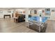 Finished basement with a ping pong table, bar and multiple seating areas at 6321 Spotted Fawn Run, Littleton, CO 80125