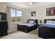 Bedroom featuring twin beds with storage drawers and bright scenic views from large window at 6321 Spotted Fawn Run, Littleton, CO 80125