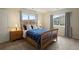 Bedroom with queen bed, side tables and views of the mountains at 6321 Spotted Fawn Run, Littleton, CO 80125