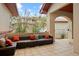 Inviting covered patio with comfortable seating and decorative pillows at 6321 Spotted Fawn Run, Littleton, CO 80125