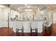 Bright and airy kitchen with a breakfast bar, stainless steel appliances, and modern finishes at 6321 Spotted Fawn Run, Littleton, CO 80125