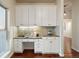 Well-lit home office with built-in cabinets and ample workspace at 6321 Spotted Fawn Run, Littleton, CO 80125