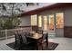 Outdoor patio with dining table and chairs, fire pit, and cozy atmosphere for entertaining guests at 6321 Spotted Fawn Run, Littleton, CO 80125