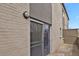 A cozy tan brick balcony with a sliding glass door at 1149 Columbine St # 202, Denver, CO 80206
