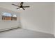 A bedroom showcasing neutral walls, a window, and plush carpeting at 1149 Columbine St # 202, Denver, CO 80206