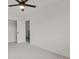 A carpeted bedroom featuring a closet and a ceiling fan at 1149 Columbine St # 202, Denver, CO 80206