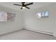 Simple bedroom with carpet, two windows, and white walls at 1149 Columbine St # 202, Denver, CO 80206