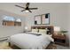 A well-lit bedroom featuring modern decor, ceiling fan, and stylish furnishings at 1149 Columbine St # 202, Denver, CO 80206