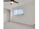 A bedroom featuring a ceiling fan, carpet, closet, and window at 1149 Columbine St # 202, Denver, CO 80206