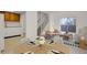 Bright living room with dining area, balcony access, and modern furnishings creating a cozy atmosphere at 1149 Columbine St # 202, Denver, CO 80206