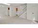Spacious living area with open staircase, seamlessly connected to the kitchen for easy living and entertaining at 1149 Columbine St # 202, Denver, CO 80206