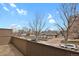 A view from the patio shows other buildings and parked vehicles in the neighborhood at 1149 Columbine St # 202, Denver, CO 80206