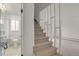 A view of the home's staircase with a bathroom visible through a doorway at 1149 Columbine St # 202, Denver, CO 80206