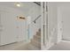 Bright staircase design with white railings, carpeted steps, and a coat rack for added convenience at 1149 Columbine St # 202, Denver, CO 80206