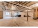 Large unfinished basement space with windows, offering potential for customization and expansion at 24197 E Ada Ave, Aurora, CO 80018
