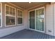 Exterior view of a cozy deck with sliding glass doors, perfect for outdoor seating and relaxation at 24197 E Ada Ave, Aurora, CO 80018
