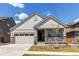 Inviting single-Gathering home with a covered porch and a well-maintained lawn at 24197 E Ada Ave, Aurora, CO 80018