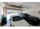 Spacious two-car garage with automatic door and ample storage space for vehicles and other items at 24197 E Ada Ave, Aurora, CO 80018
