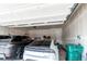 Clean garage with a finished ceiling and room for multiple vehicles at 24197 E Ada Ave, Aurora, CO 80018
