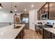 Large kitchen features a center island, stainless steel appliances, and modern cabinetry at 24197 E Ada Ave, Aurora, CO 80018