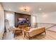 Bright living room features hardwood floors, cozy seating, and modern decor with ample natural light at 24197 E Ada Ave, Aurora, CO 80018