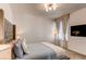 Comfortable main bedroom with plush bedding, stylish decor, and a large window with natural light at 24197 E Ada Ave, Aurora, CO 80018