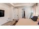 Bright main bedroom showcasing an attached ensuite bathroom and a large window with a tray ceiling at 24197 E Ada Ave, Aurora, CO 80018