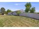 Backyard view showing the long lawn, landscaping, and privacy fence at 6924 S Albion St, Centennial, CO 80122