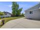 Concrete patio and backyard with healthy lawn and perimeter trees at 6924 S Albion St, Centennial, CO 80122