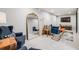 Finished basement with cozy seating area, ample lighting, and large mirror at 6924 S Albion St, Centennial, CO 80122
