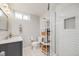 Modern bathroom showcasing tiled floors, stylish vanity, and walk-in shower at 6924 S Albion St, Centennial, CO 80122