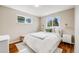 Cozy bedroom featuring hardwood floors, dual windows and white furnishings at 6924 S Albion St, Centennial, CO 80122