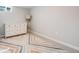 A minimalistic bedroom is brightened with a colorful geometric patterned rug at 6924 S Albion St, Centennial, CO 80122