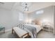 Cozy bedroom featuring a metal bed frame and modern lighting fixture at 6924 S Albion St, Centennial, CO 80122