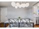 Dining room features a modern light fixture and table, creating a stylish dining experience at 6924 S Albion St, Centennial, CO 80122