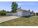 Front exterior shot of a home with a long driveway and a one-car garage at 6924 S Albion St, Centennial, CO 80122