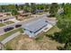 Charming single-story home with a well-manicured lawn and a long driveway at 6924 S Albion St, Centennial, CO 80122