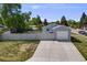 View of attached single car garage and wide driveway at 6924 S Albion St, Centennial, CO 80122