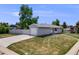 Charming single-story home with a well-manicured lawn and a long driveway at 6924 S Albion St, Centennial, CO 80122