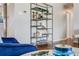 Stylish metal bookshelf display and hardwood floors add character to the open-concept living space at 6924 S Albion St, Centennial, CO 80122