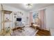 Stylish office space with natural light, hardwood floors and a unique hanging chair at 6924 S Albion St, Centennial, CO 80122