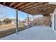 Covered concrete patio showcasing support pillars and a view of the backyard at 9201 E 153Rd Ave, Brighton, CO 80602