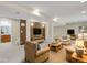Spacious finished basement featuring ample seating and warm lighting at 5521 S Yakima St, Aurora, CO 80015
