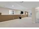 Spacious, finished basement area featuring neutral carpeting at 5521 S Yakima St, Aurora, CO 80015